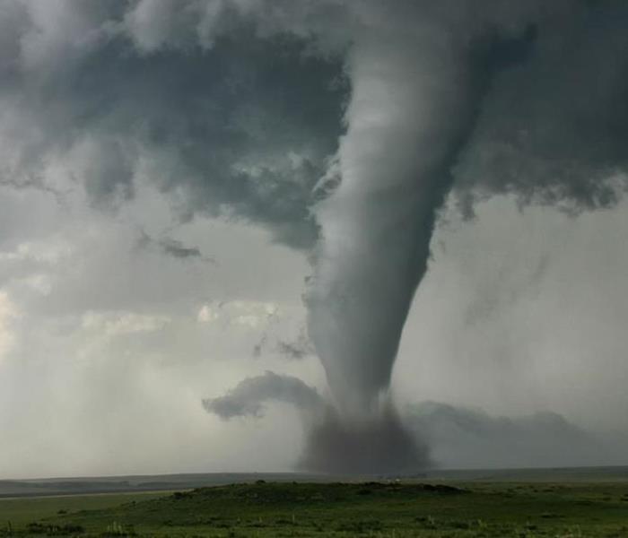 Tornado in an open field